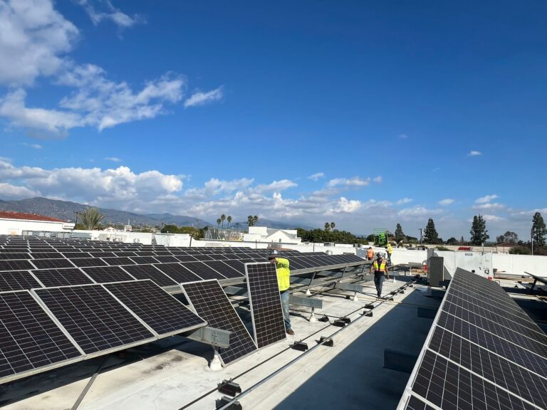 Electrical work on a commercial building structure related to solar power.