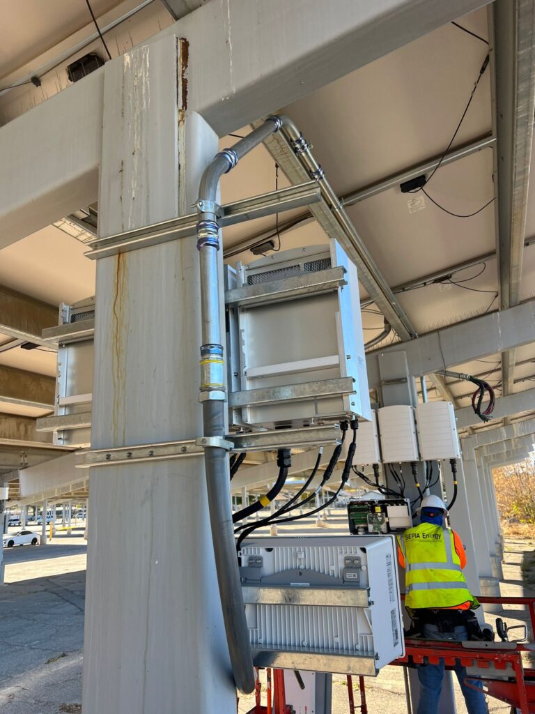 Vertical view of the electrical equipment showing the installation of new string inverters.