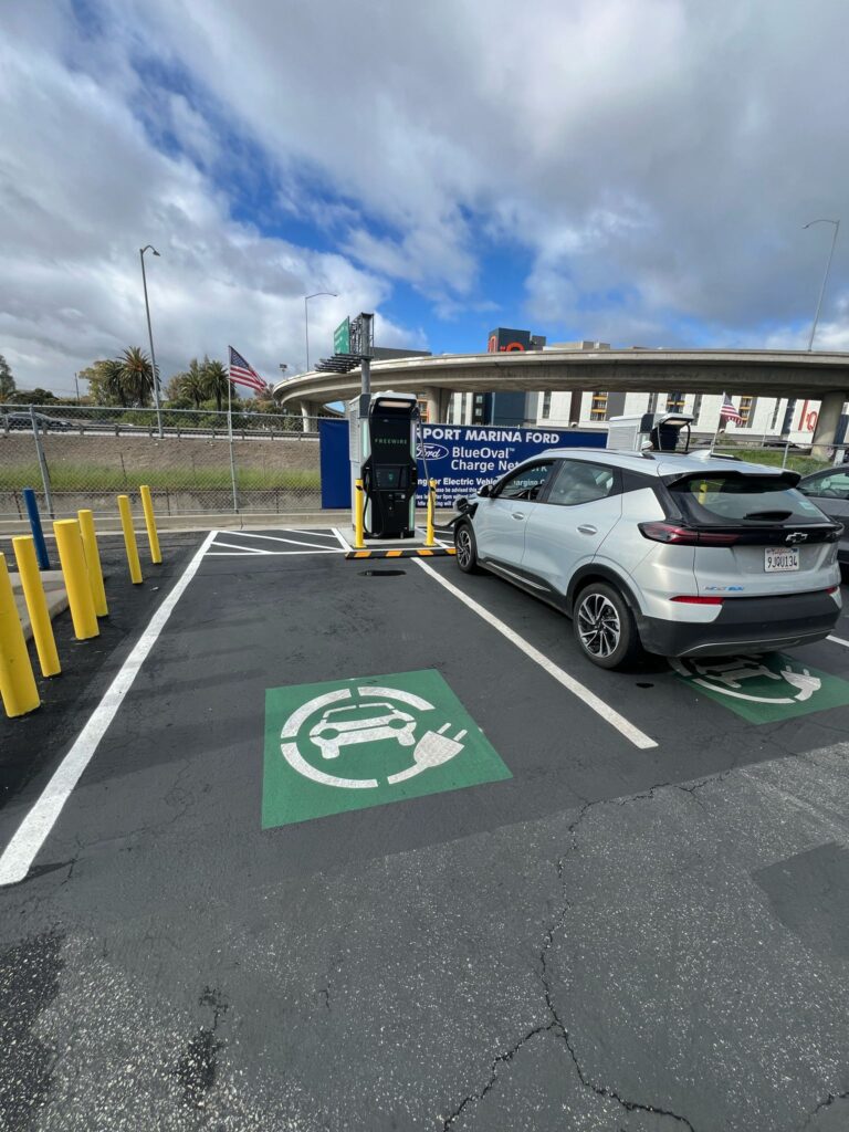 Vertical view of the finished EV charging equipment and parking signage.