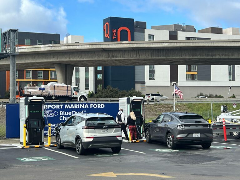 Electrician working on the main electrical connection for the EV charging project.
