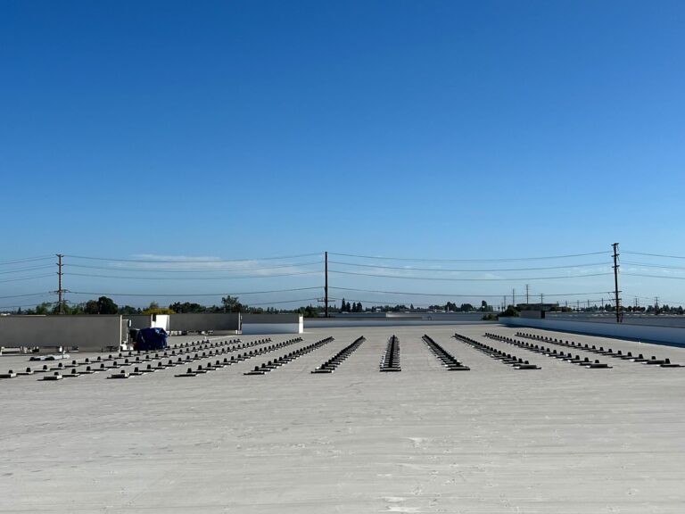 Panoramic view of a completed solar installation across a Public Storage complex.
