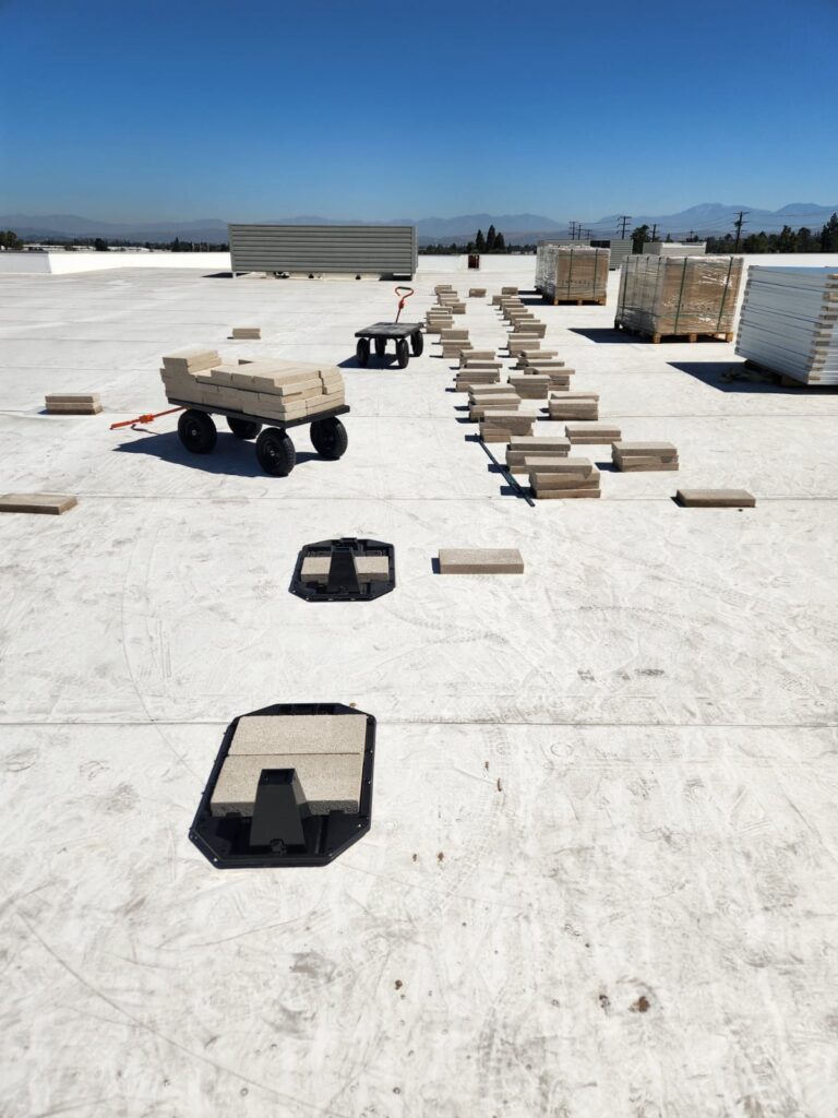 Close-up of solar equipment, possibly inverters or racking, on the storage unit roof.