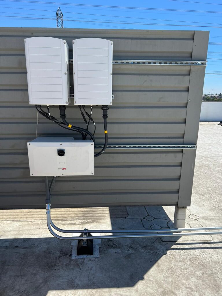 Vertical shot showing solar panels on a Public Storage rooftop or carport structure.