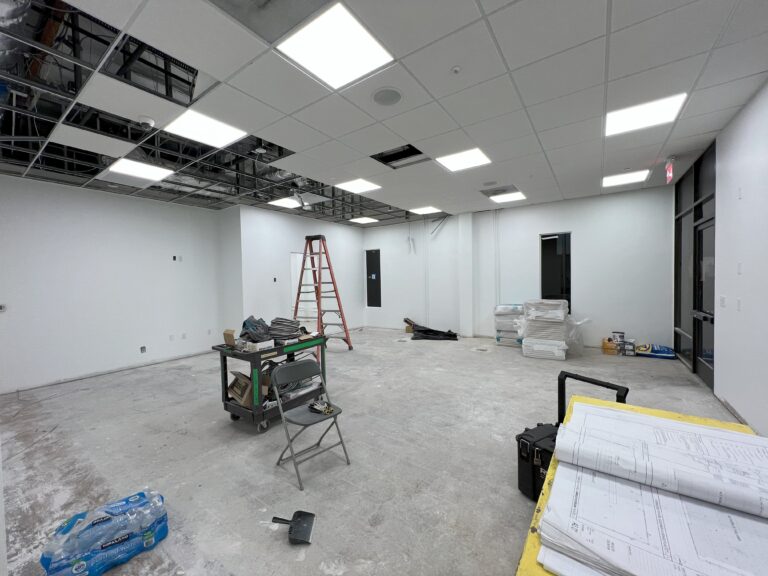 View of the service bay, possibly showing the upgraded vehicle lift equipment.