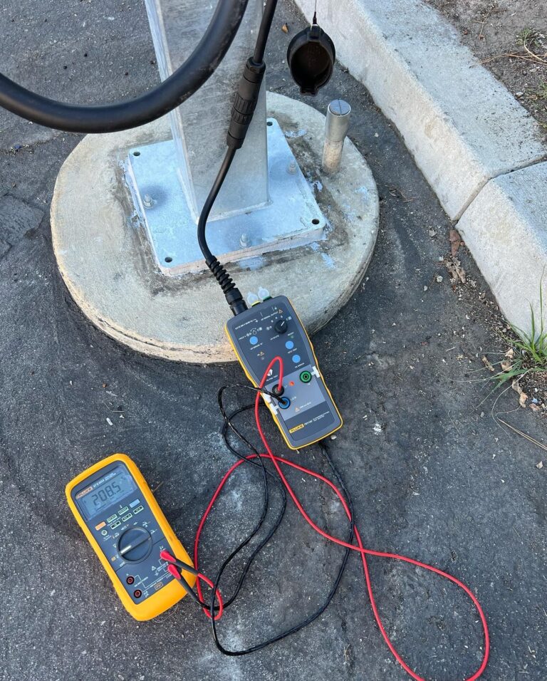 Technician working on an industrial electrical system or motor control center.